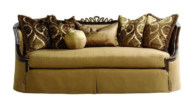 Chantelle&nbsp;Sofa shown with: Boxed bench seatWaterfall&nbsp;skirt with built-in sides, back, and button detailAccessory tassel tiesOld World Hazelnut finishAged Gold Leaf finish trimBronze Star nailhead frame trim