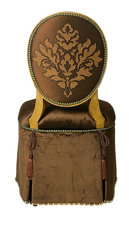 Mirielle Vanity&nbsp;Chair&nbsp;shown with:Tight seat and backDeep skirt with decorative tape along bottom of skirtVenetian Gold finishZanzibar nailhead frame trimAccessory tassel ties