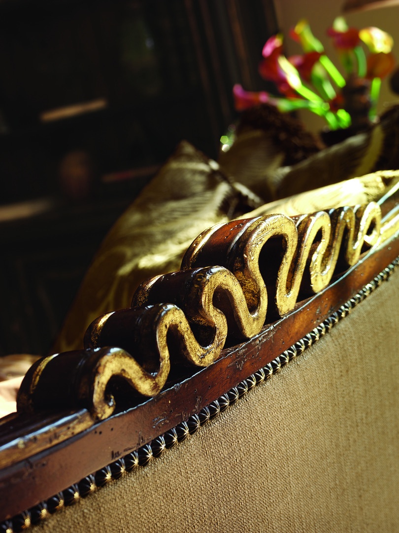 Chantelle&nbsp;Sofa shown with: Boxed bench seatWaterfall&nbsp;skirt with built-in sides, back, and button detailAccessory tassel tiesOld World Hazelnut finishAged Gold Leaf finish trimBronze Star nailhead frame trim
