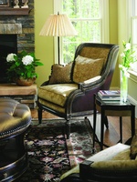 Emperador Lounge&nbsp;Chair&nbsp;shown with:Boxed seat cushionSumatra finishAged Gold Leaf finish trimNailhead frame trim