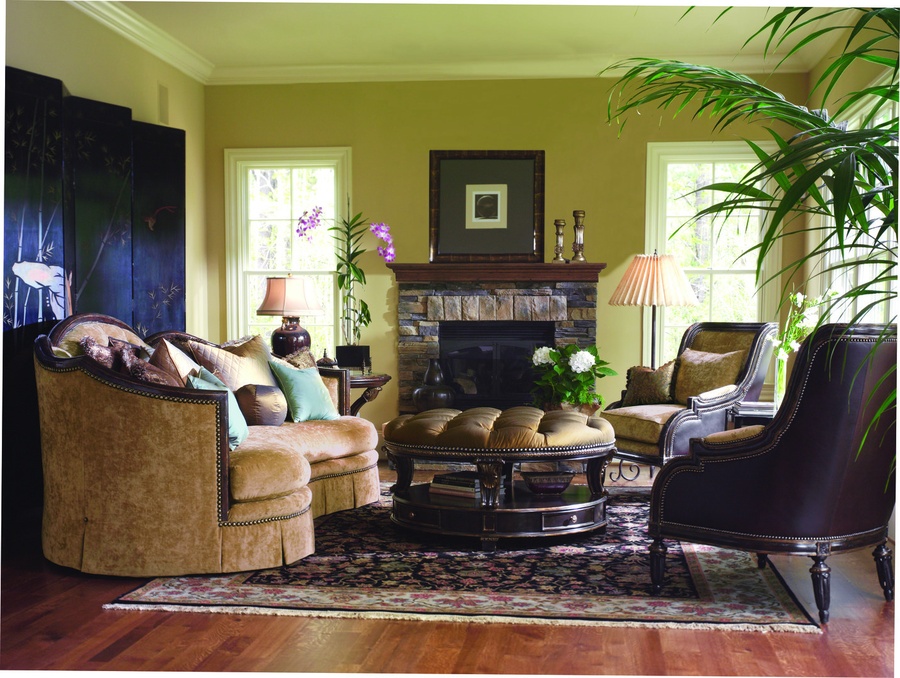 Natalia Sofa shown with: Boxed bench seatButton tufted back Deep box pleated skirt with built-in sides and backExposed carved hardwood frame in choice of select finishesBronze Star nailhead frame trim