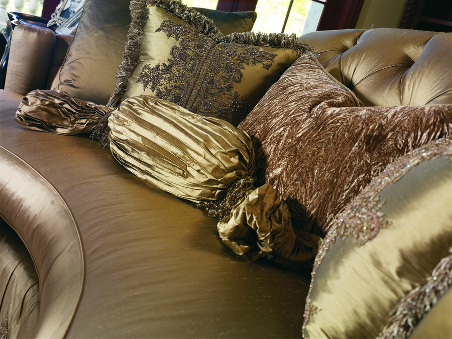 Paulina Sofa shown with: Boxed bench seatButton tufted back Box pleated waterfall skirt with dressmaker back and button detailDecorative skirt panel detail