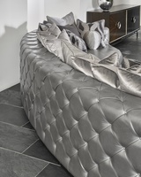 Aurora&nbsp;2-Piece Sofa shown with:Boxed bench seatSilver button tufted inside and outside backBuilt-to-the-floor with wood plinth in Bombay finish