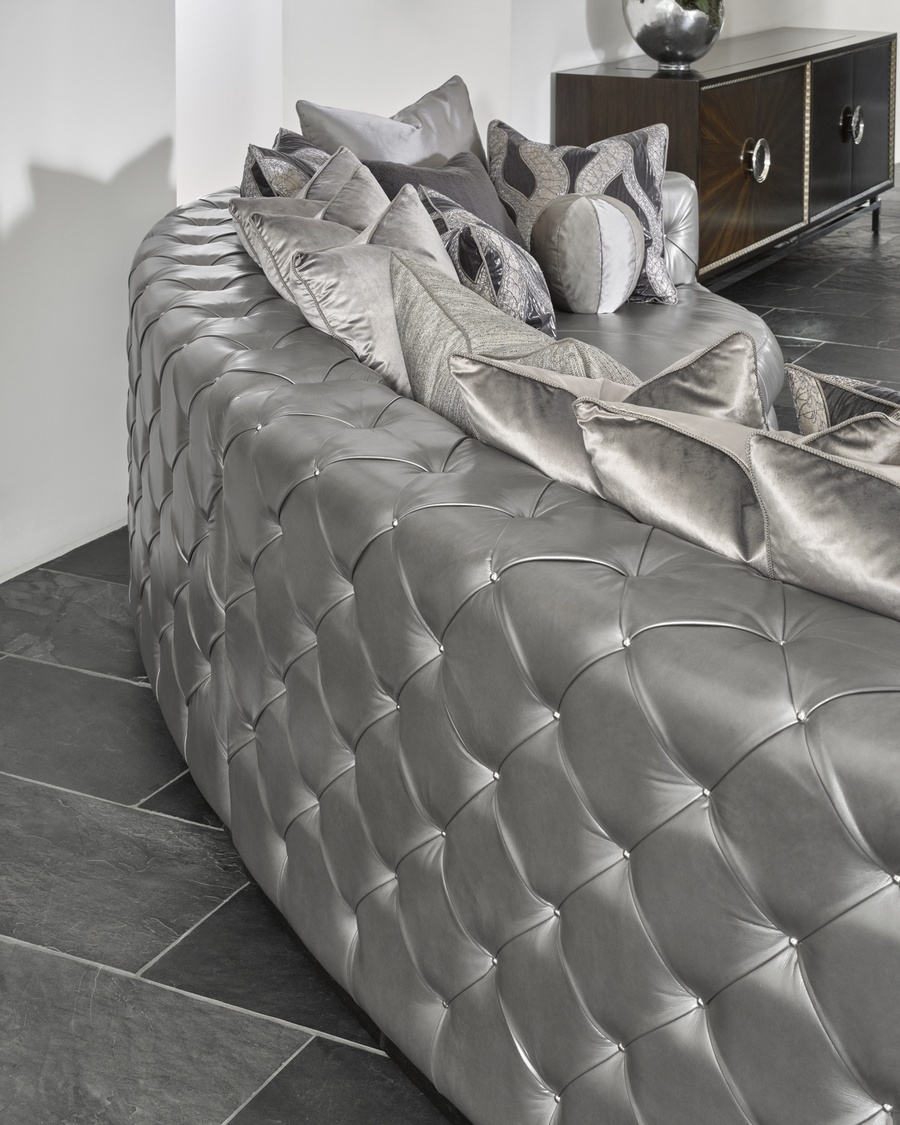 Aurora&nbsp;2-Piece Sofa shown with:Boxed bench seatSilver button tufted inside and outside backBuilt-to-the-floor with wood plinth in Bombay finish