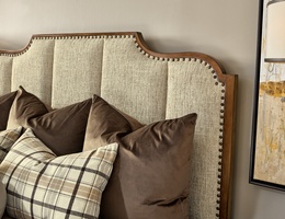 Cadence Panel Bed shown with:Cadence finishMetal Ferrules in&nbsp;Antique Brass finishMedium&nbsp;mottled nailhead spaced over Self Fabric tape
Headboard Fabric:&nbsp;Darling BeigeAlternate fabrics available