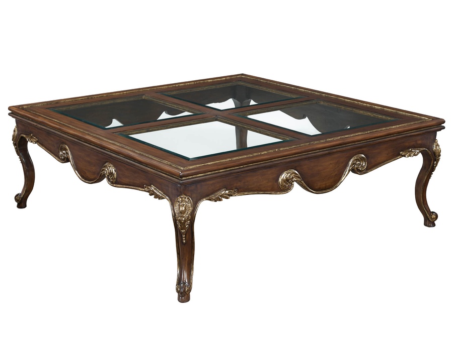 Calais Cocktail Table shown with:Briar&nbsp;finishAged&nbsp;Gold finish trimInset clear&nbsp;glass top with beveled edge&nbsp;