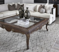 Calais Cocktail Table shown with:Briar&nbsp;finishAged&nbsp;Gold&nbsp;finish trimInset clear&nbsp;glass top with beveled edge&nbsp;