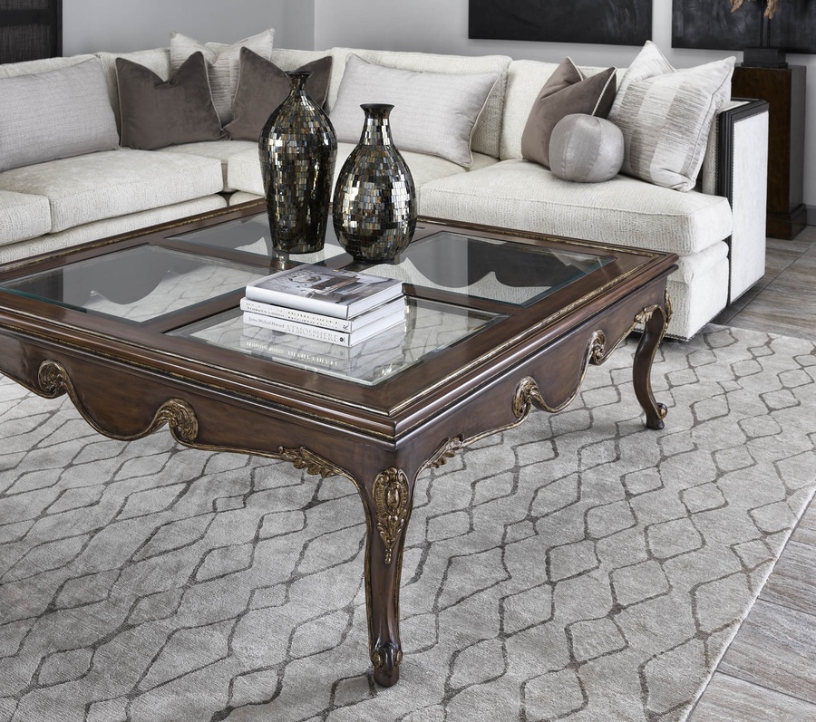 Calais Cocktail Table shown with:Briar&nbsp;finishAged&nbsp;Gold finish trimInset clear&nbsp;glass top with beveled edge&nbsp;