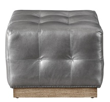 Coronado Ottoman shown with:Box Quilted Tight SeatPlinth Base in&nbsp;Almond&nbsp;finishGunmetal nailhead frame trim24" sq.