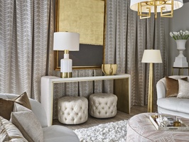 Cascade Console shown with:Ensemble&nbsp;finish with&nbsp;Cashmere Gold&nbsp;finish trimCashmere&nbsp;Gold inside leg finishClear&nbsp;Mirror topChanneled&nbsp;upholstery