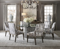 Cascade Dining Table shown with:Slate&nbsp;finish with Aged&nbsp;Silver finish trimChanneled&nbsp;upholstery72" Diameter glass top