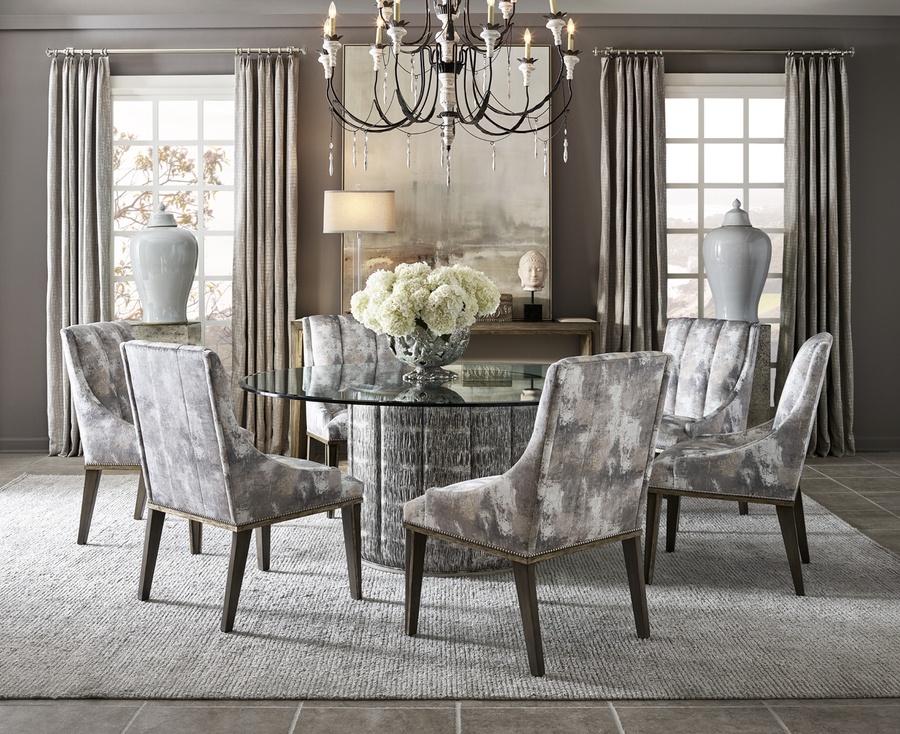 Cascade Dining Table shown with:Latte finish with Aged Medici finish trimDiamond Tufted upholstery60" Diameter glass top