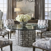 Cascade Dining Table shown with:Slate&nbsp;finish with Aged&nbsp;Silver finish trimChanneled&nbsp;upholstery72" Diameter glass top