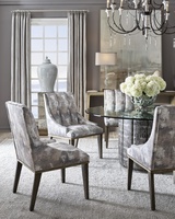Cascade Dining Table shown with:Slate&nbsp;finish with Aged&nbsp;Silver finish trimChanneled&nbsp;upholstery72" Diameter glass top