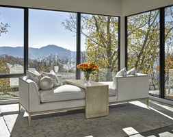 Libra Chaise shown with:(2) LIB44 Chaises and (1) LIB30 Accent TableBoxed bench seatBuilt-to-the-floor base with exposed wood legsin Dapple&nbsp;finishPewter nailhead frame trim