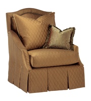 Marcella&nbsp;Chair shown with:Boxed seat cushionBox pleated waterfall front skirt with dressmakersides and back and button detailAntique Brass&nbsp;nailhead frame trim