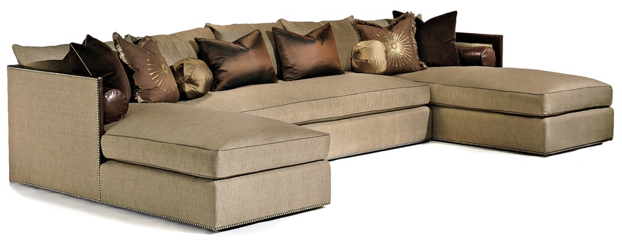 Olympia&nbsp;Sectional shown with:(2) OLY44, (1) OLY 60Boxed bench seatContrast panel on top of arm and backBuilt-to-the-floor baseAntique Brass nailhead frame trim