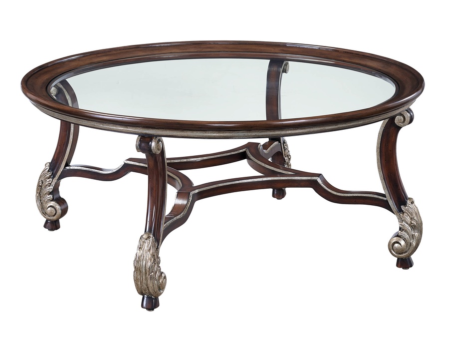San Marino Cocktail&nbsp;Table&nbsp;shown with:Briar finishBurnished&nbsp;Silver finish trimInset clear glass top with beveled edge