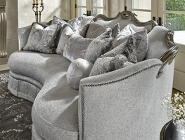 Versailles Sofa shown with:Boxed bench seatDeep skirt with built-in sides and back and decorative button detailTape trim&nbsp;at bottom edge of skirtBronzed Silver finish with Verona Silver leaf finish trimSilver Star nailhead frame trim
Includes&nbsp;eight pillows: (1) 26" x 32" Knife Edge Pillow (2) 26"&nbsp;sq. Knife Edge Pillows(2) 24"&nbsp;sq. Knife Edge Pillows(2) 22"&nbsp;sq. Knife Edge Pillows(1) 10" Ball Pillow
Optional&nbsp;pillow shown:(1) 17" x 24" Knife Edge Pillow