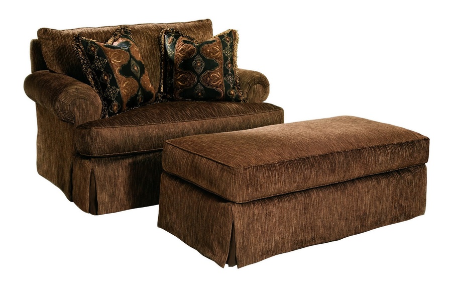 Santa Barbara Chair&nbsp;shown with:Knife Edge Back PillowBoxed straight cushionTrack&nbsp;ArmBuilt-to-the-floor baseNailhead frame trim